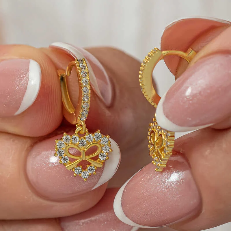 Gümüş Gold Kalp Kurdele Sallantılı Kadın Küpe 1 Gümüş Gold Kalp Kurdele Sallantılı Kadın Küpe